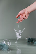 Hand Holding A Glass Christmas Decoration Ballerina