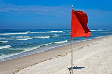 Red Warning Flag On The Beach, Barra Da Tijuca, Rio De Janeiro