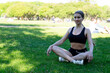 © zerbob2 - beautiful young brunette doing sports on the grass in the park