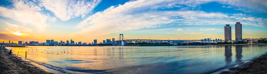 Wall Mural - Sunset panorama view of Tokyo skyline and Rainbow Bridge