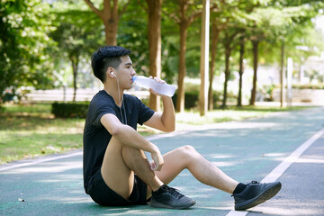 Wall Mural - Man taking a break from exercise