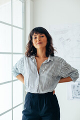 Confident businesswoman standing in office