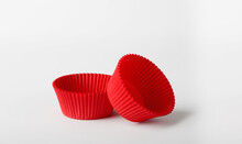 
Two Paper Ribbed Shapes Of Red Color On A White Background Close-up