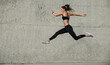 © Jacob Lund - Female athlete running and jumping outdoors