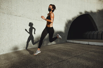 Wall Mural - Female athlete on morning running workout