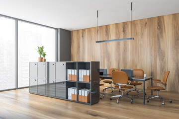 Wooden office room with shelf for folders and brown furniture