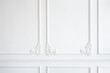 © Наталья Бирюкова - white wall decorated with stucco in the form of decorative curls