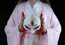 Woman Wearing Kimono And A Fox Mask. Japanese Traditional Concept.