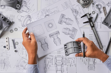 Fototapete - Engineer technician designing drawings mechanical parts engineering Engine.manufacturing factory Industry Industrial work project blueprints measuring bearings caliper tools