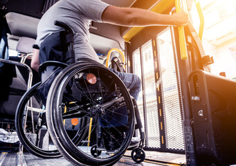 A man in a wheelchair inside of a specialized vehicle 