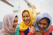 © Alessandro Biascioli - Happy Muslim women walking in the city center - Arabian young girls having fun spending time and laughing together outdoor - concept of lifestyle people culture and religion