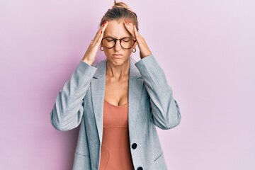 Wall Mural - Beautiful caucasian woman wearing business jacket and glasses with hand on head for pain in head because stress. suffering migraine.