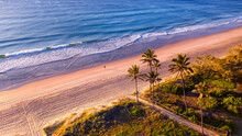 Aerial View Over Gold Coast Main Beach And Ocean With Palm Trees And Sunrise Light.