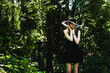 © Zaliya - Summer Fashion. Beautiful Young Woman In Hat, Dress In Nature Portrait