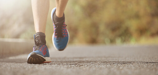 Wall Mural - Fitness man runner athlete running at road, working out cardio on nature landscape