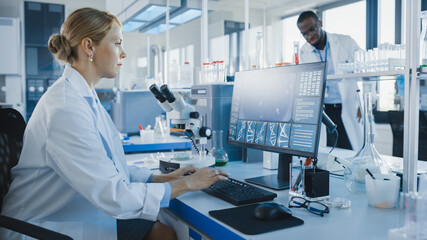 Wall Mural - medical science laboratory with diverse team of biochemistry scientists developing drugs, female mic