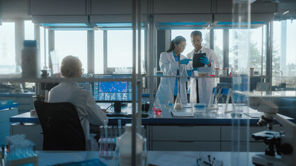 Wall Mural - medical science laboratory with diverse team of biochemistry research scientists talking, two microb