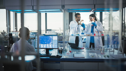 Wall Mural - medical science and biotechnology laboratory with diverse team of research scientists working. micro