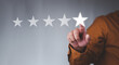 © Looker_Studio - Customer service experience and business satisfaction survey, businessman touching with a screen Five stars (5) rating, Feedback, review and rating concepts.