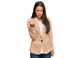 Sticker - Beautiful hispanic woman wearing business jacket angry and mad raising fist frustrated and furious while shouting with anger. rage and aggressive concept.