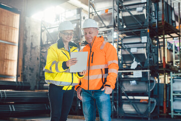 Wall Mural - Workers checking inventory of warehouse