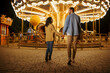 © Nomad_Soul - Love couple at the carousel, night amusement park
