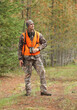 © Nathan Allred - modern deer hunter standing in forest full length