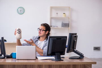 Young male it specialist working in the office