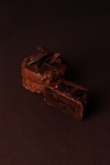 Canvas Print - Stack of chocolate brownies chocolate cake on a brown background