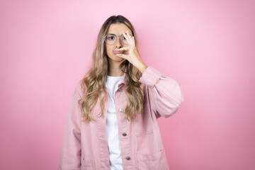 Young beautiful blonde woman with long hair standing over pink background mouth and lips shut as zip with fingers. Secret and silent, taboo talking