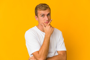 Young caucasian handsome man contemplating, planning a strategy, thinking about the way of a business.