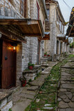 Fototapeta Uliczki - The picturesque village of Dilofo during fall season with its architectural traditional old stone  buildings located on Tymfi mount, Zagori, Epirus, Greece, Europe
