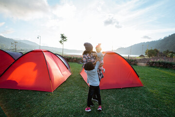 Portrait happy of the campground family with beautiful hill views