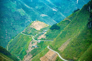 Supply lines of Ma Pi Leng Pass rugged northwest Vietnam's most beautiful with winding road full of clouds mountainside. We come to love the country of Vietnam more