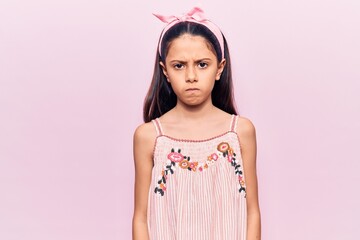 Wall Mural - Beautiful child girl wearing casual clothes skeptic and nervous, frowning upset because of problem. negative person.