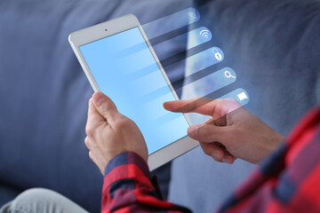 Canvas Print - Handsome man with tablet computer indoors. Concept of internet