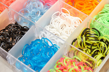 A set of colorful rubber bands and loom knit for knitting wristbands.