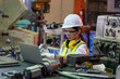 © visoot - Industry worker woman under inspection and checking production at factory by laptop.