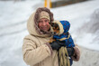 © Vladimir Arndt - Aged woman with her dog. Selective focus.