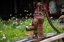 A Historical Water Pump In A Garden Near A Wooden House On The Village. The Old Well At The Historic Cottage, Japan.
