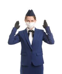 Canvas Print - Beautiful stewardess in medical mask on white background