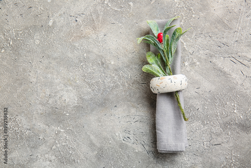 Napkin with mistletoe for Christmas dinner on grunge background