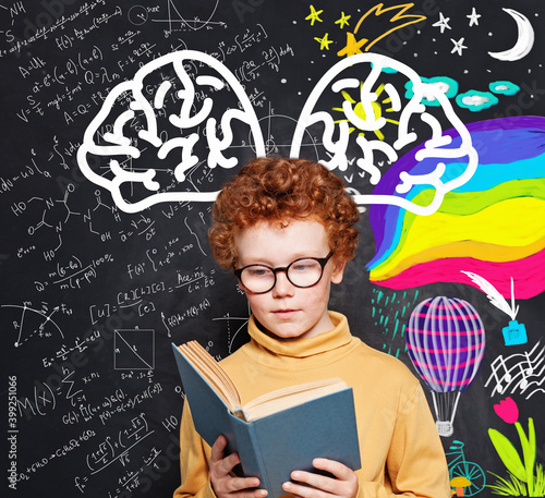 Valokuva Kid reading a book. Science and arts occupations