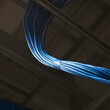 © Mint Images - Blue power cables in server room.