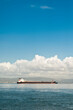 © Mint Images - Shipping tanker entering harbour.
