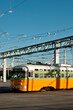 © Mint Images - Tram with power lines above.