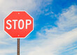 © Mint Images - Red stop sign in the road