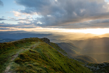 view of sunset above mountains peak