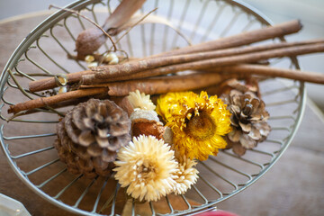 Wall Mural - Flowers and cinnamon on the plate
