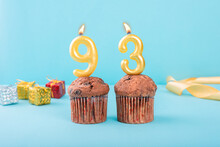 93 Number Gold Candle On A Cupcake Against A Pastel Blue Background Ninety Three Year Celebration